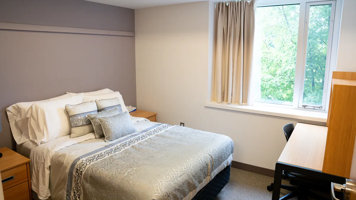 Ontario Hall Suite Bedroom showing bed, window and desk
